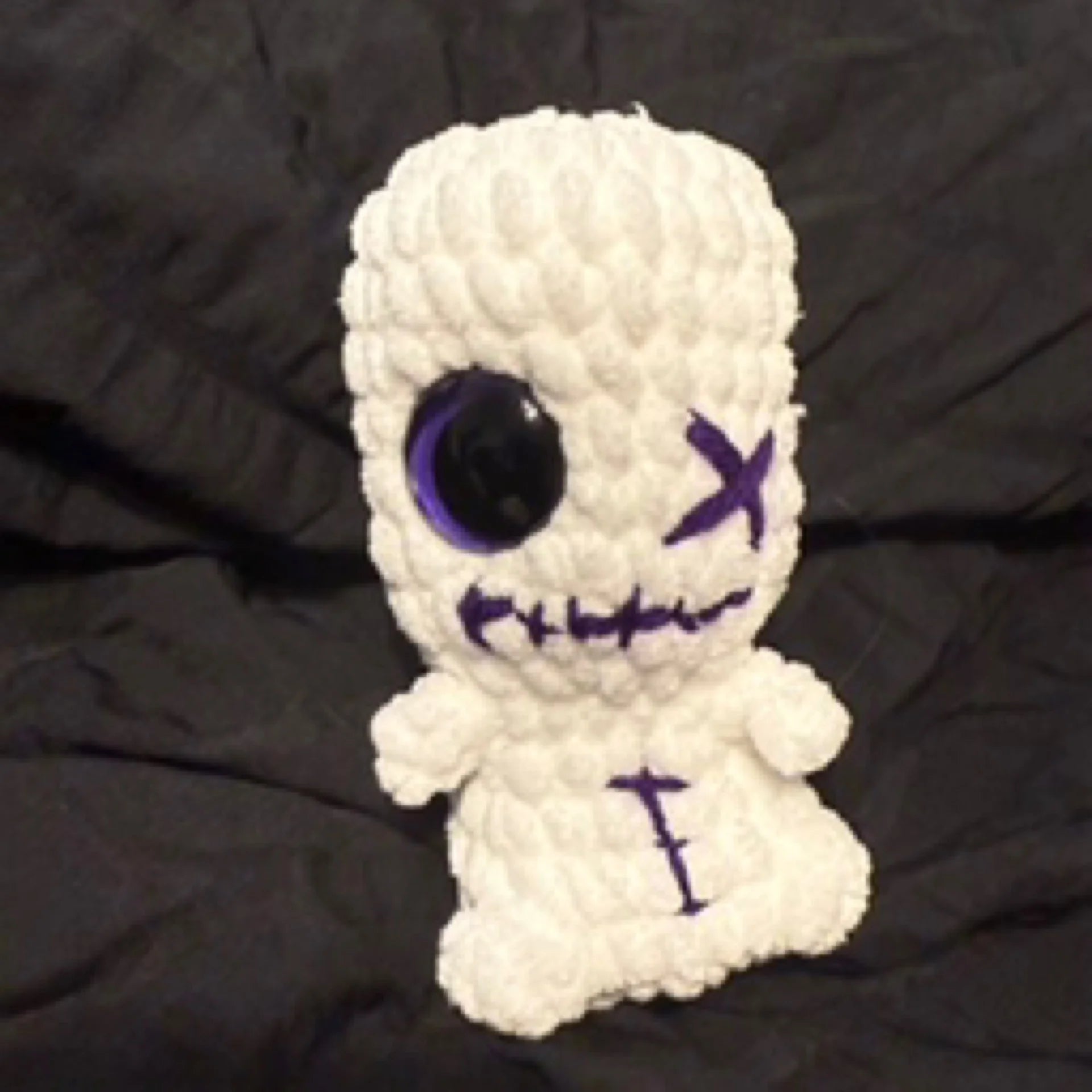 White and purple Voodoo Doll