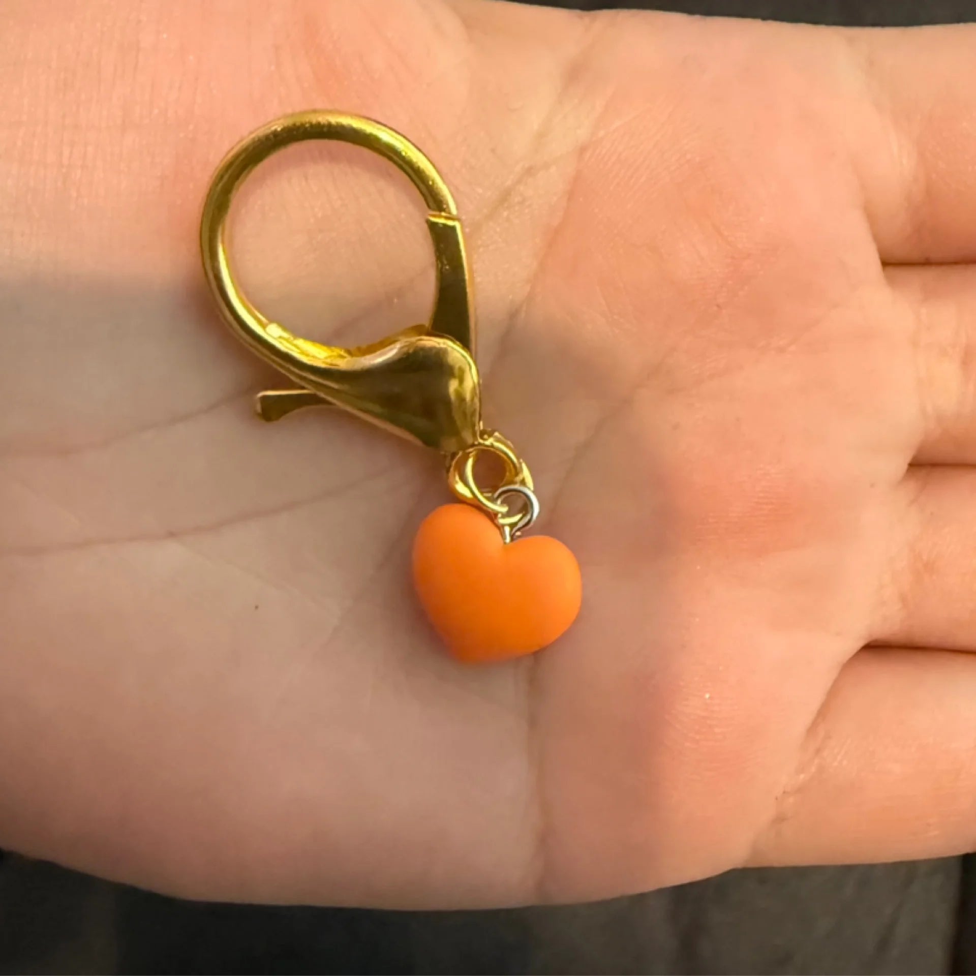 Orange heart stitch marker