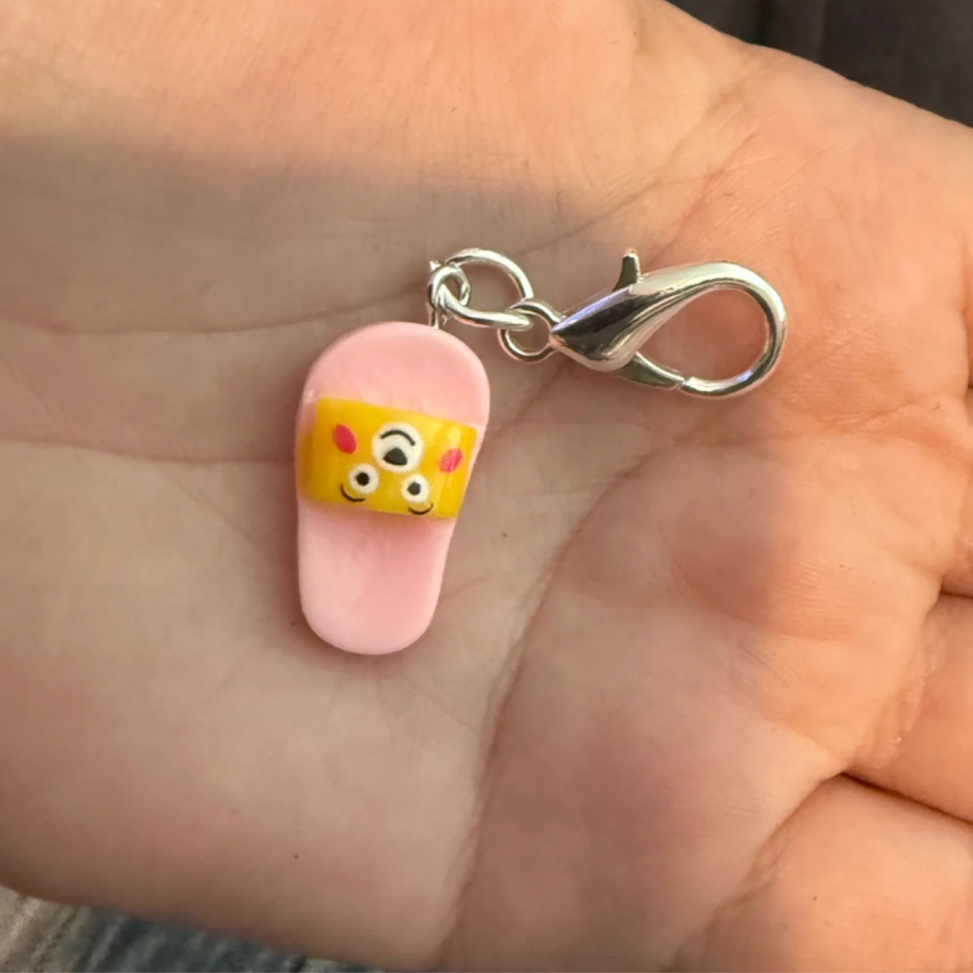 Pink bear slipper stitch marker
