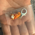 Orange gnome stitch marker