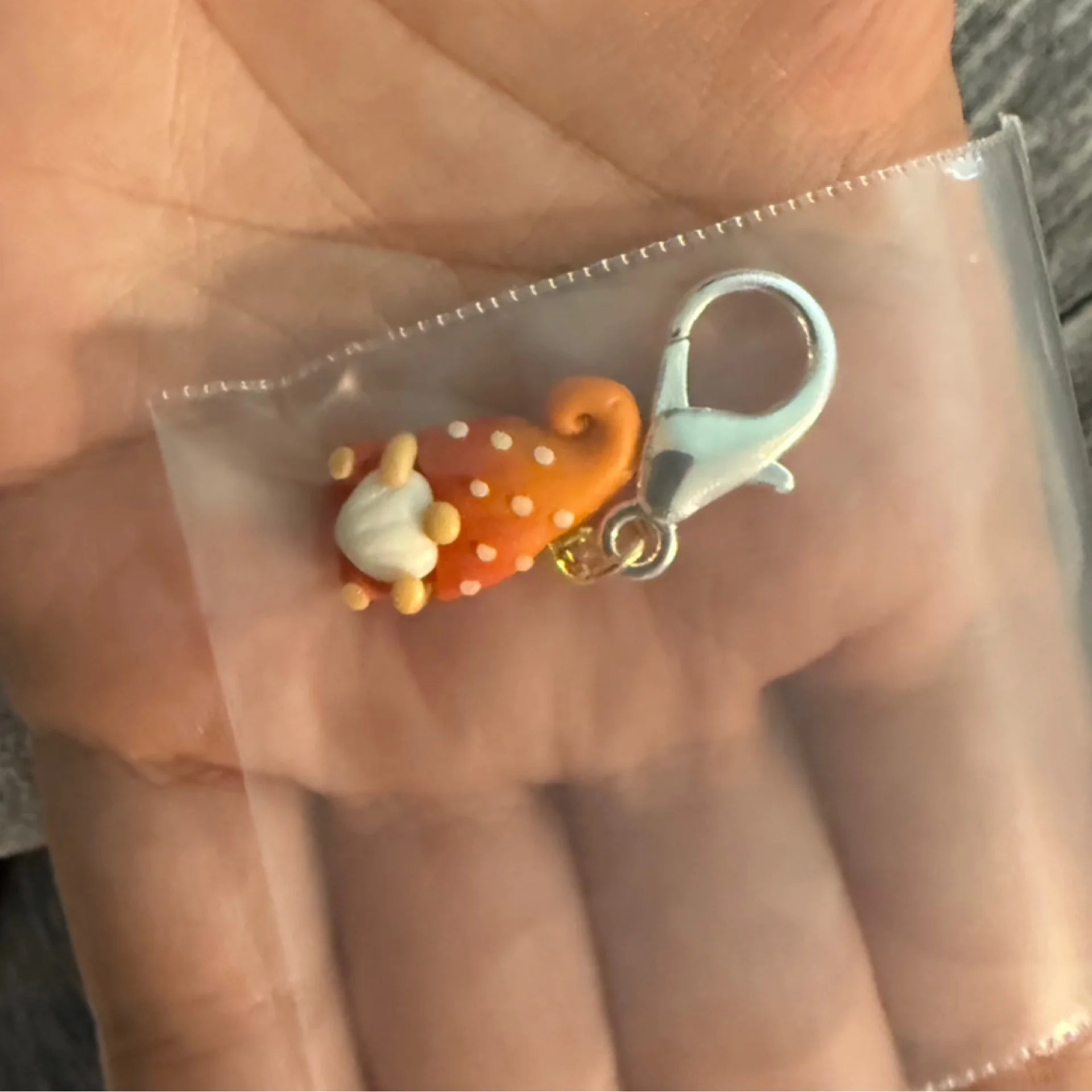 Orange gnome stitch marker